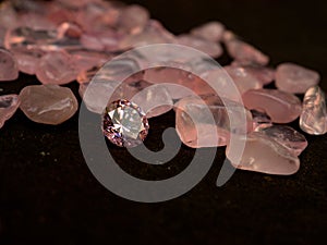 Pink colored diamond on black background