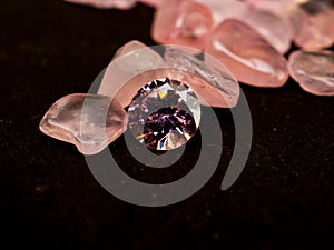 Pink colored diamond on black background