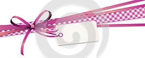 pink colored ribbon bow with hang tag