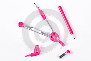 Pink compasses and pencil for drafting.