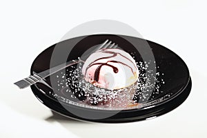 Pink Cream Cake on Black Plate