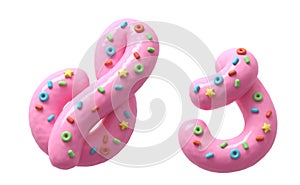 Pink cream with colorful sweets font. Letter S.