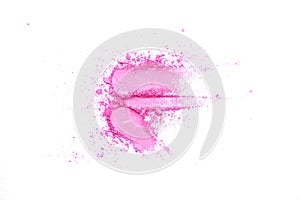 Pink crushed eye shadow isolated on white background. Splatter make up and cosmetic products