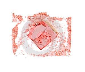 Pink crushed eyeshadow on white background.