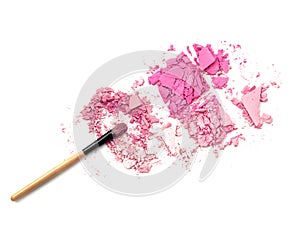 Pink crushed make up powder and brush isolate.
