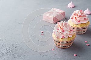 Pink cupcakes with heart shaped candy for Valentines Day