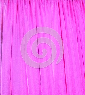 Pink curtain texture. Pink curtain background. Texture in pink. Pink fabric texture or background.