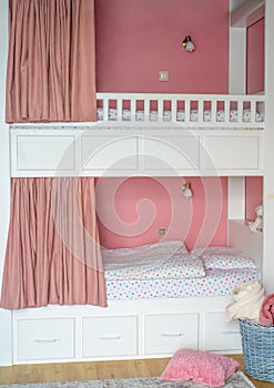 Pink curtains for bunk bed for girls in the bedroom without people