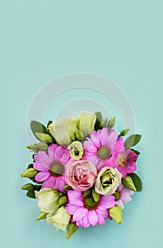 Pink daisies on a green background. Spring flower arrangement.