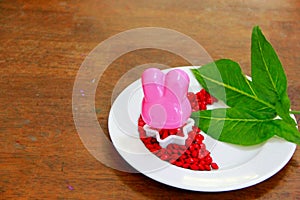 Pink dessert and green leaves