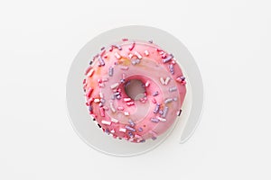 Pink donut against white background