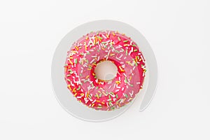Pink donut against white background