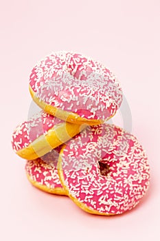 Pink donuts on pink background