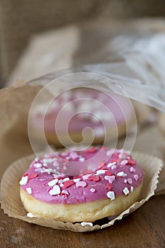 Pink donuts with sugar icing