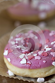 Pink donuts with sugar icing