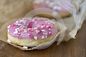 Pink donuts with sugar icing