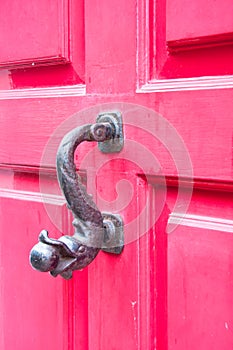 Pink door with fish door knocker