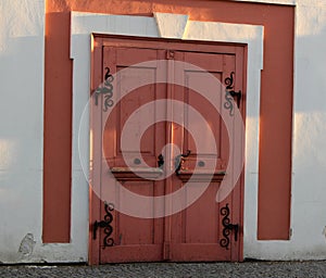 Pink door with ironwork photo