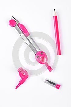 Pink drawing compasses and pencil.