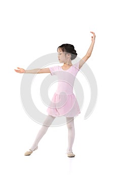 Pink dressed Asian girl in a ballet pose