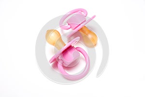 Pink dummies or pacifiers photo