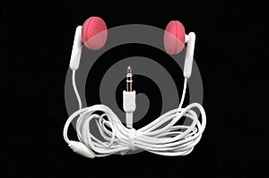 Pink Earbuds black background