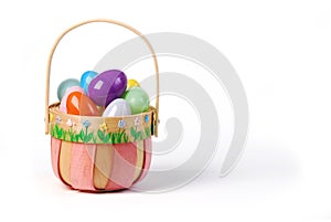 Pink Easter basket with colorful eggs