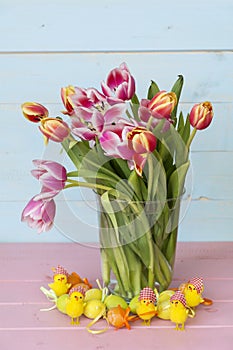 Pink Easter Eggs and Tulips Flowers  on a  Wooden Background