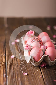 Pink Easter eggs on wodden background. Copyspace. Still life photo of lots of pink easter eggs.Background with easter eggs