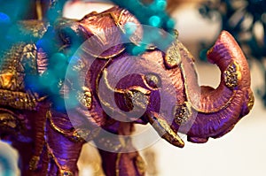 Pink elephant with gold as a Christmas tree decoration