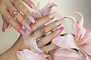 Pink elongated nail extension.