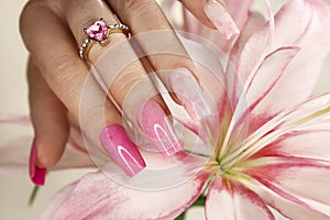 Pink elongated nail extension.