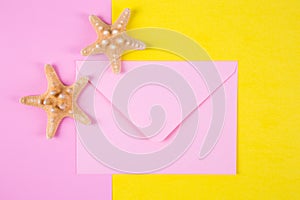 Pink envelope with two starfishes on colored backgrounds with ne