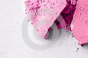 Pink eye shadow powder as makeup palette closeup isolated on white background, crushed cosmetics and beauty texture