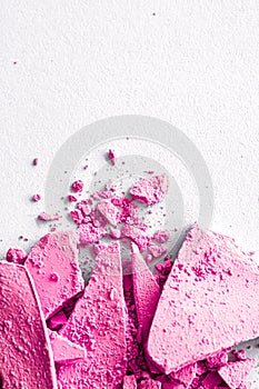 Pink eye shadow powder as makeup palette closeup isolated on white background, crushed cosmetics and beauty texture