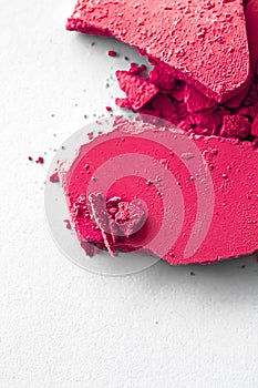 Pink eye shadow powder as makeup palette closeup isolated on white background, crushed cosmetics and beauty texture