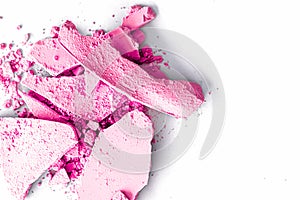 Pink eye shadow powder as makeup palette closeup isolated on white background, crushed cosmetics and beauty texture