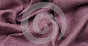 Pink fabric background. Pink cloth waves background texture.