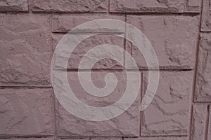 Pink facing tile with stone-like texture