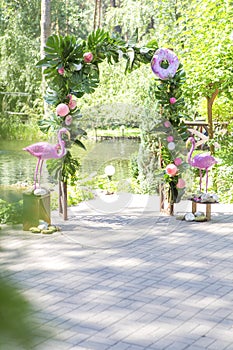 Pink fake flamingo wedding decoration with anthurium flowers and