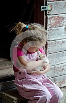 Pink farm girl and kitten