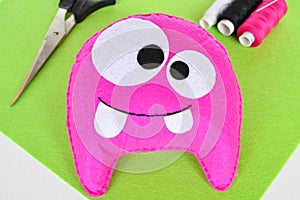 Pink felt monster - handmade toy. Step by step. Halloween diy crafts decoration tutorials. DIY monster doll sewing for kids photo photo