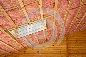 Pink Fiberglass Roof Insulation in Sloping Roof photo