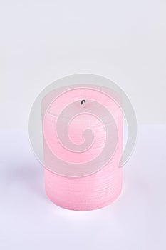 Pink fireless candle isolated on white surface.