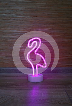 Pink Flamingo LED Night Light. Stylish lamp made of flexible neon. Trendy silhouette with empty space.