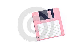 Pink floppy disk on white background