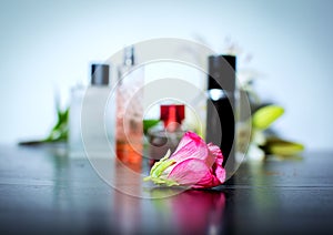 Pink flower on perfumes background