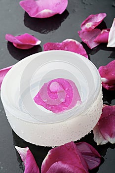 Pink flower petal and water bowl decoration.