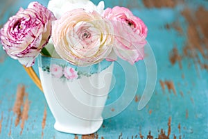 Pink Flower in teacup photo