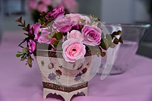 Pink flower vase on the table
